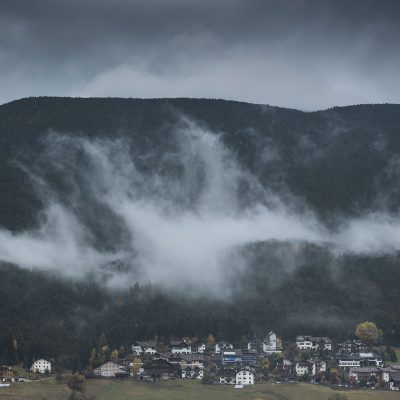 Cloudy day over Bolzano village in Dolomites