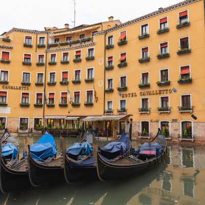 Gondolas parked in front of an hotel in Venezia