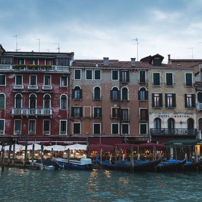 Gondolas parked in front of an hotel in Venezia