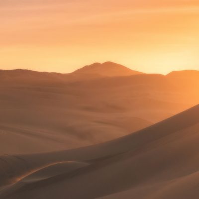 Sunset over Huacachina desert in Peru