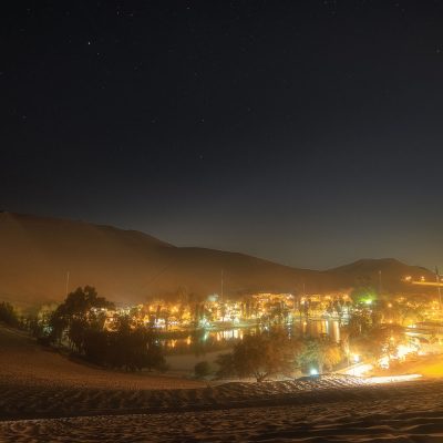 Huacachina village by night in the desert of Peru