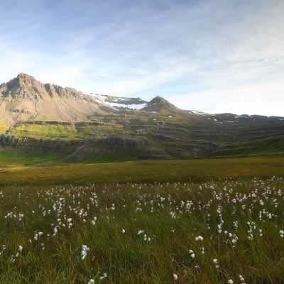 The sun light hitting a mountain in the Eastern Fjord of Iceland