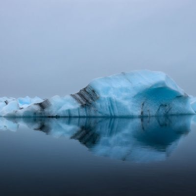 Perfect reflection of an Iceberg in Jokulsaron Lagoon of Iceland