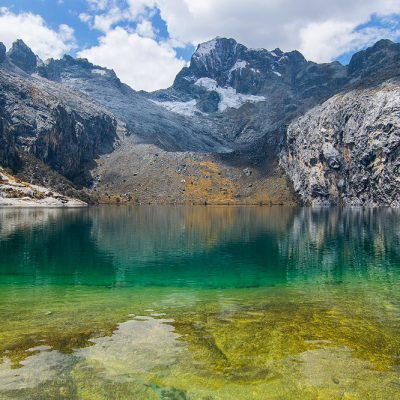 Cordillera Blanca moutain range reflecting in Laguna Churup