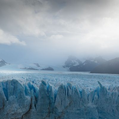 Sun litting up a part of Perito Moreno Glacier during a cloudy Fall day