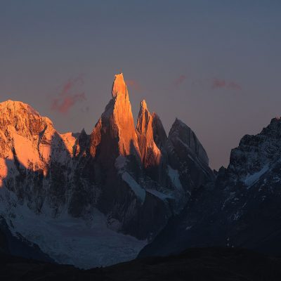 Cerro Torre lit up by first ray of sun during sunrise