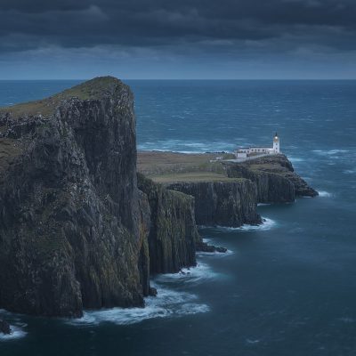 Nest Point lighthouse is the westernmost point of Isle of Skye, during a moody fall sunset